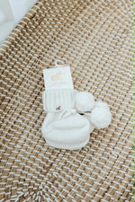 Load image into Gallery viewer, Confetti Kidz Baby Knit Booties - Poms Milk (0-6 Months)