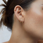 Load image into Gallery viewer, Linda Tahija Alpha Huggie Earrings - Rose GoldWhite Topaz
